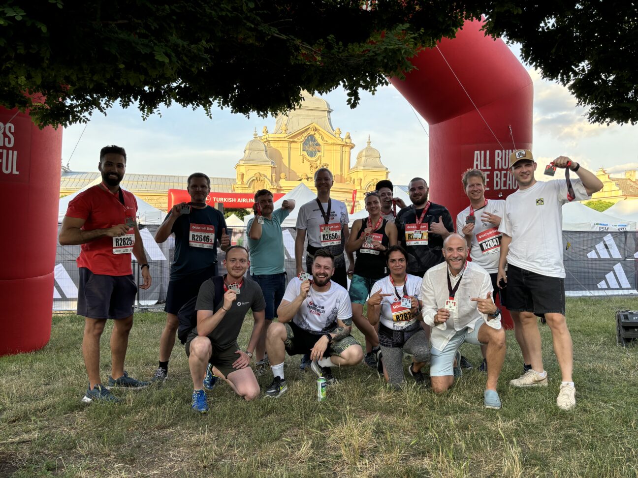 Devoteam team members proudly display their medals after participating in the 2024 Prague Relay Race.
